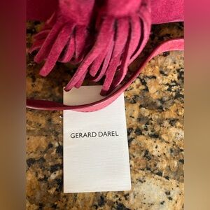 Behold the fabulous Gerard Darrell suede fuchsia handbag with trendy fringe!